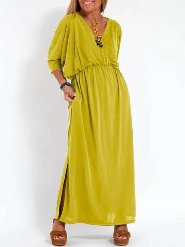 Vestido longo com fenda e bolsos, cintura elástica e manga curta, conforto máximo